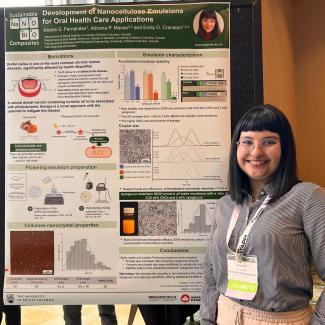 Ariane standing in front of her poster at TAPPINano