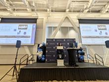 Vivian standing at podium at a UBC dentistry event